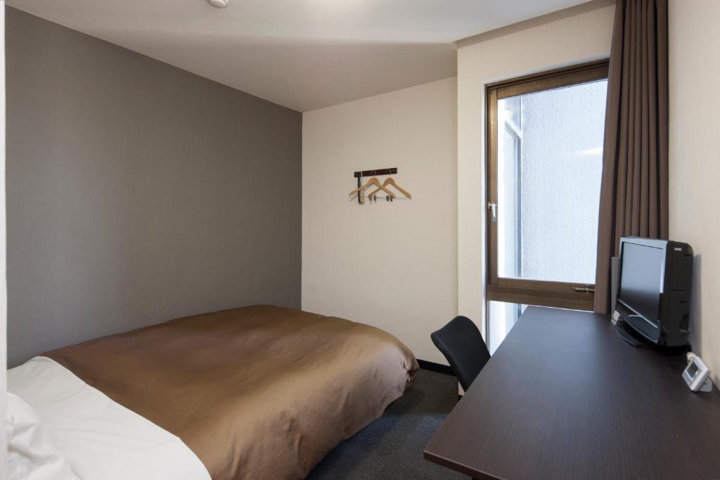 Hotel Plaza Inn Tokushima Quarto foto