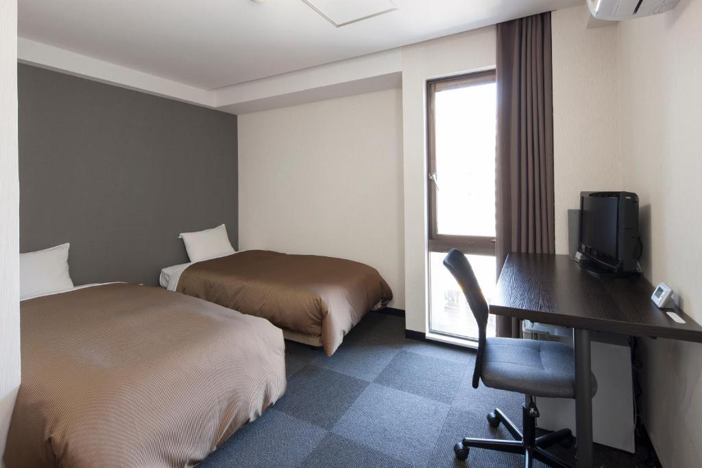 Hotel Plaza Inn Tokushima Quarto foto