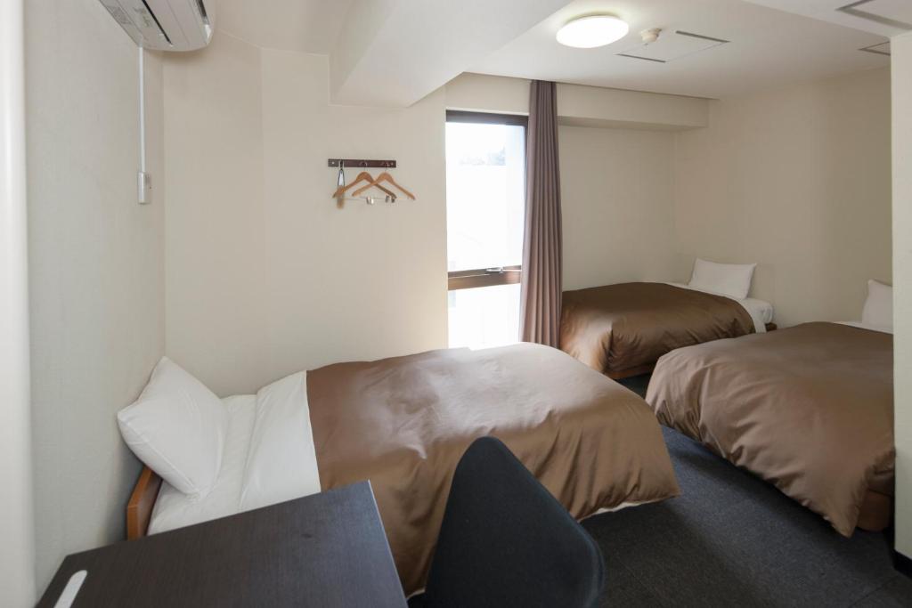 Hotel Plaza Inn Tokushima Quarto foto